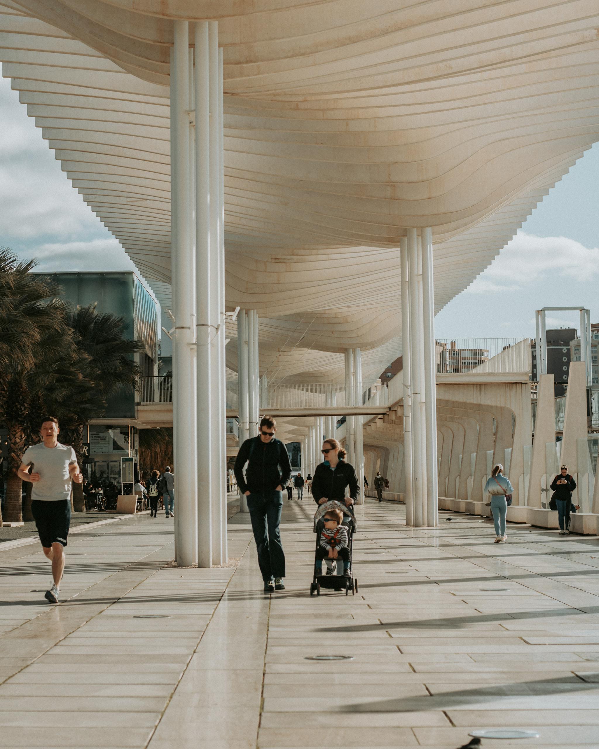 View of Pedestrians Walking at the Muelle Uno in Malaga, Spain
